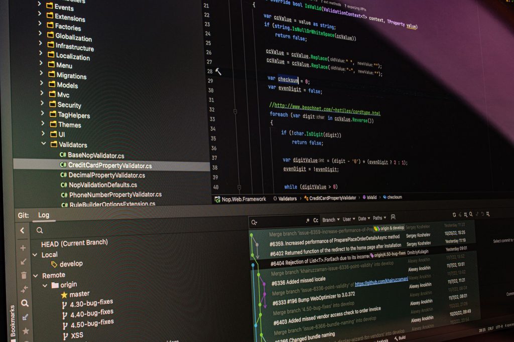 Close-up of software development tools displaying code and version control systems on a computer monitor.