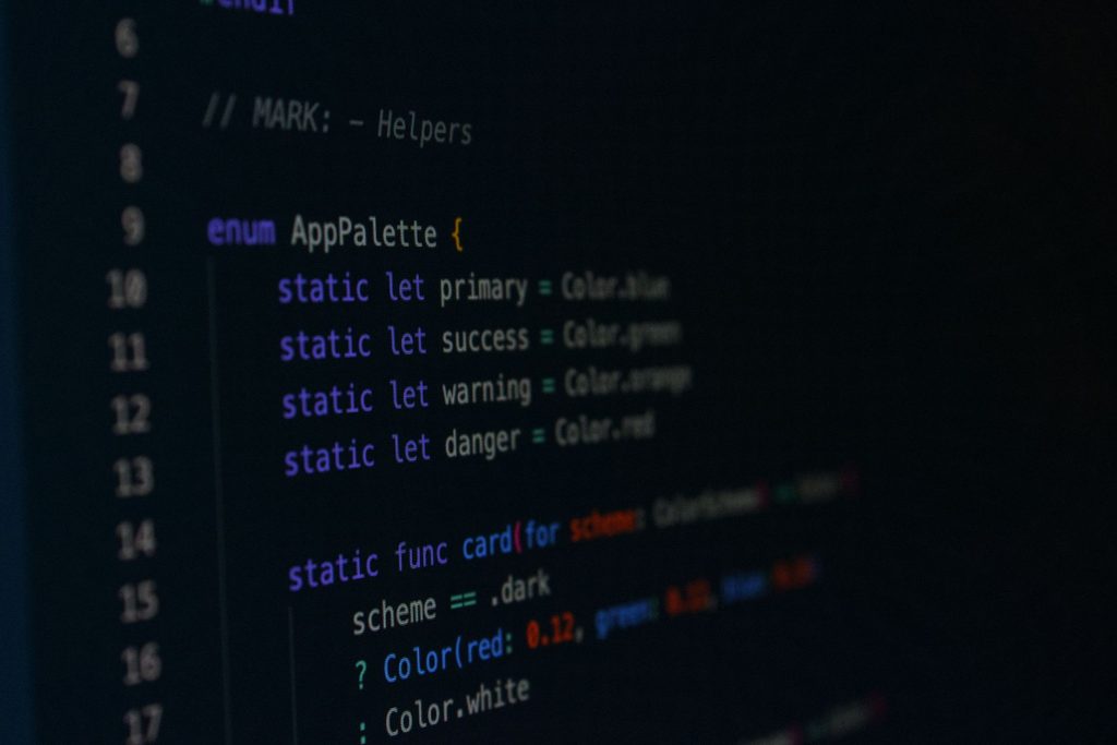 Macro photography of color palette code in a programming environment.