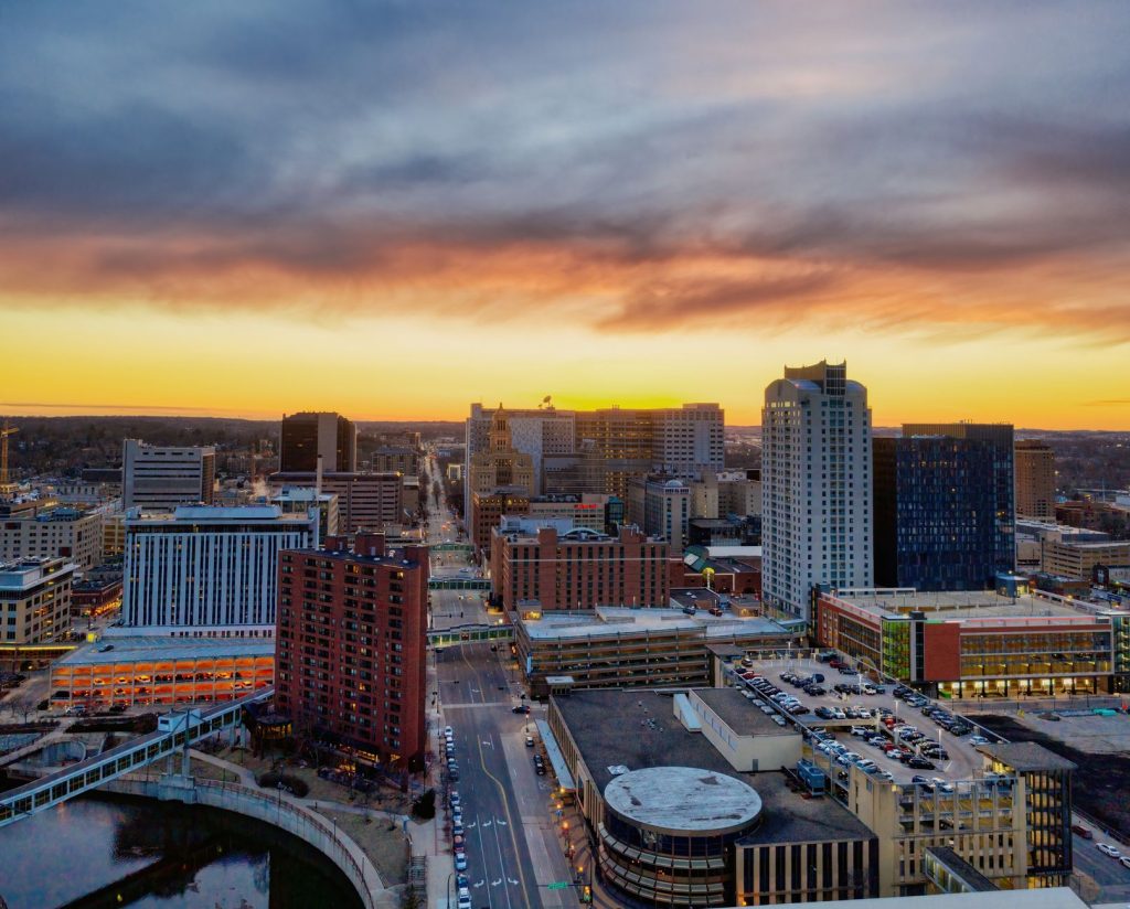 Stunning aerial image of Rochester, Minnesota skyline at sunset with dramatic skies.